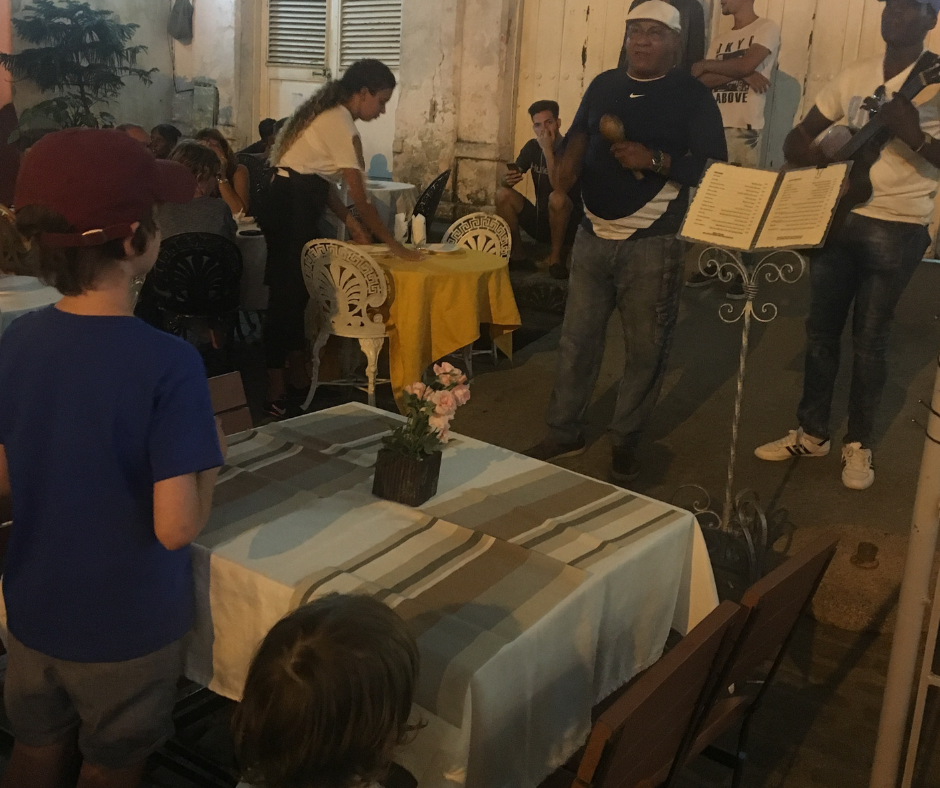 Lukas and Sawyer watching live music over dinner