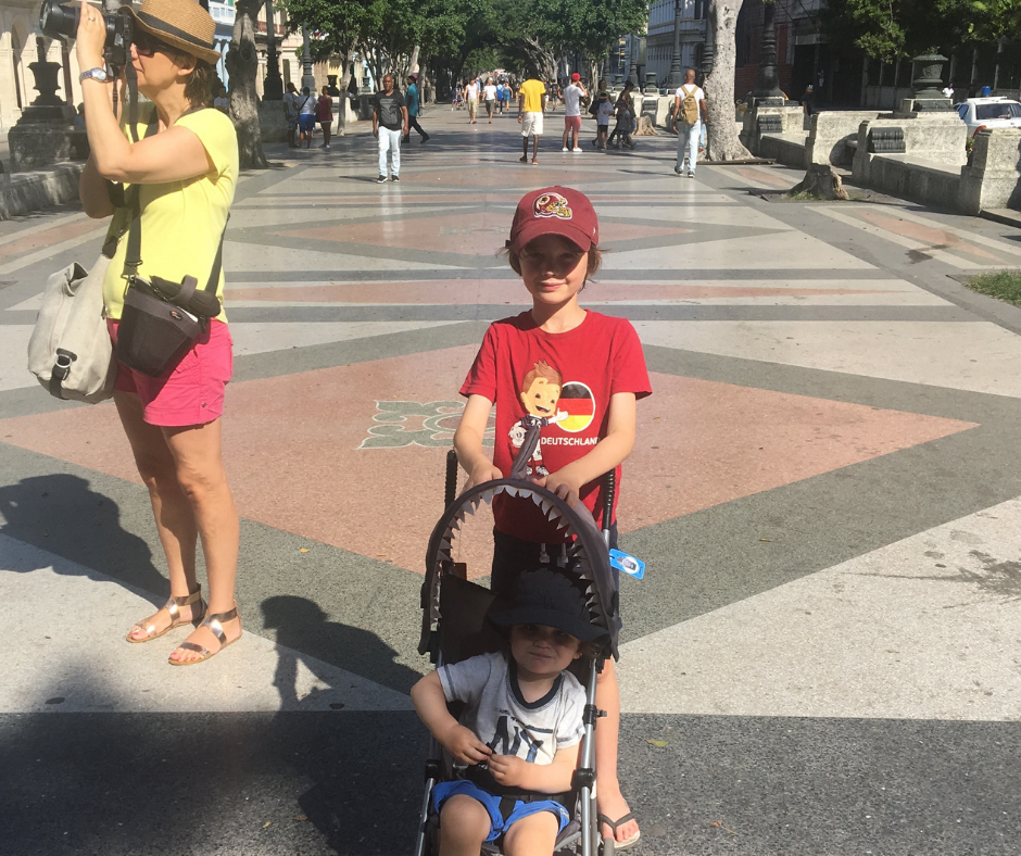 Family taking one last stroll down Paseo del Prado