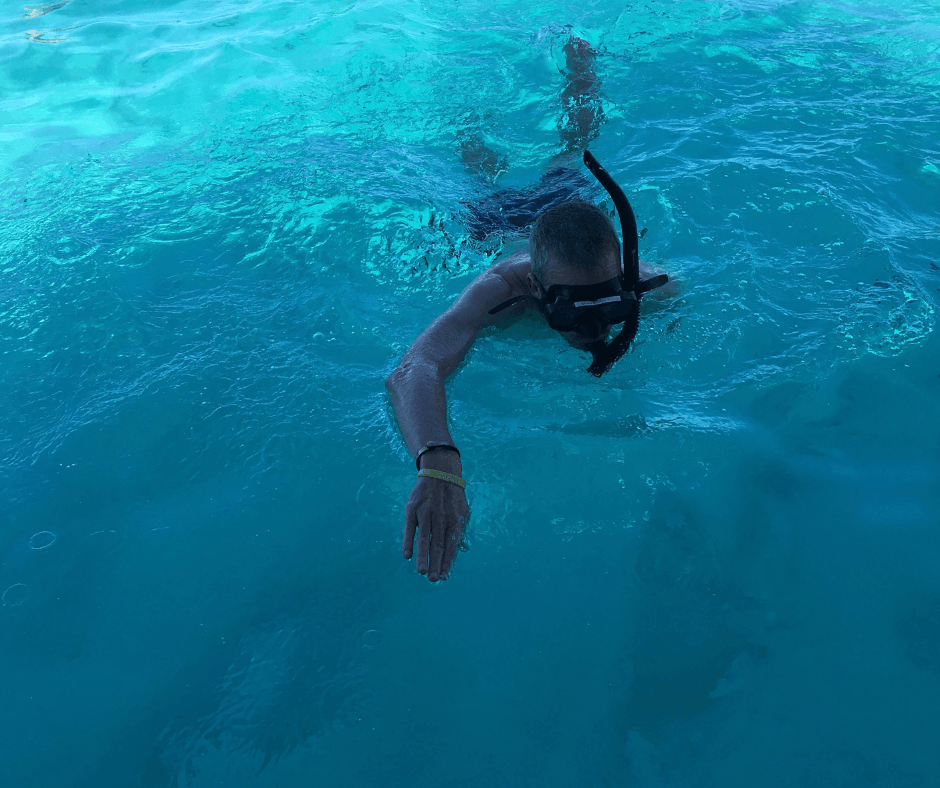 Dad snorkelling on Kota cruise. Beautiful waters and plenty of fish