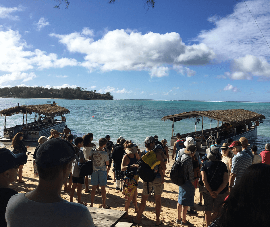 Everyone waiting on the beach, ready to board to Kota boats for a great day out