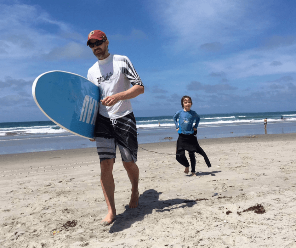 Hopping out of the sea after a great time surfing