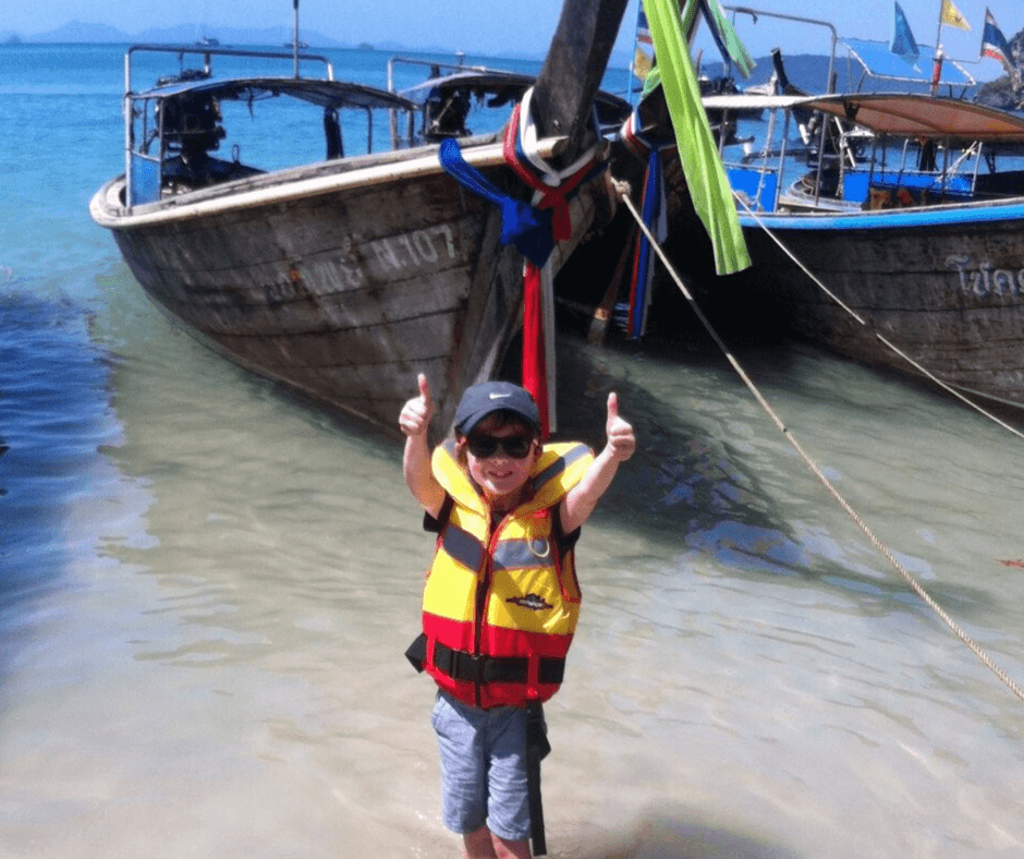 Thumbs up from Lukas as we board the long boat and say goodbye to Railay Beach