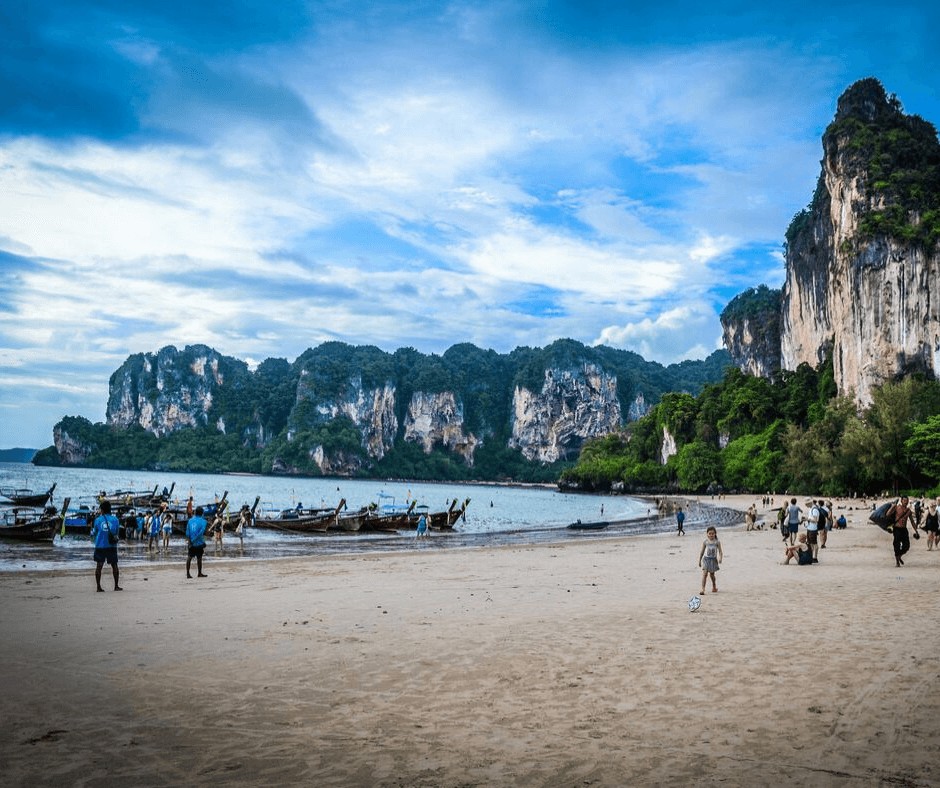 West Railay beach, looking along the white sand beaches with the long tail boats parked up