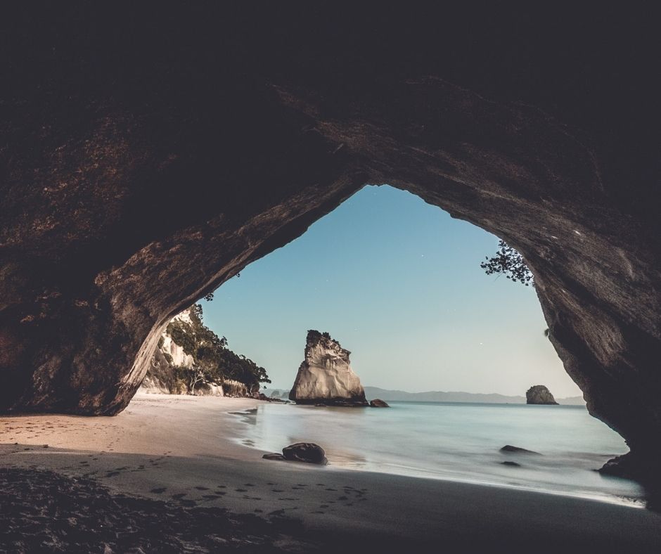 Cathedral Cove, looking though the hole in the rock at the sea and surrounding landscape