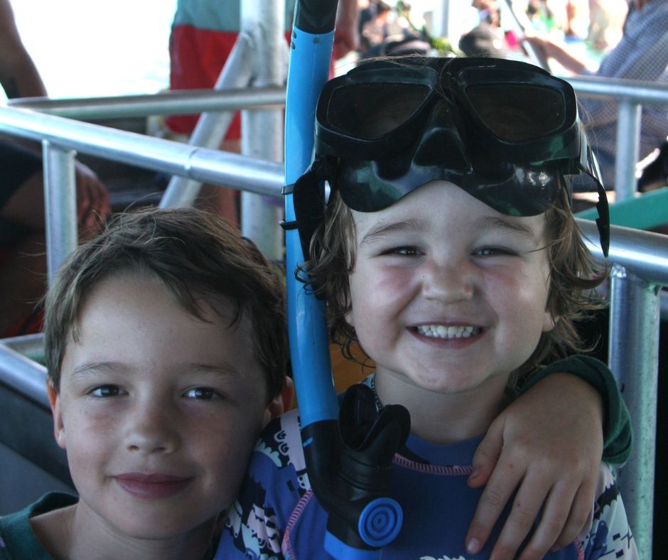 Boys getting already to snorkel, posing for the camera