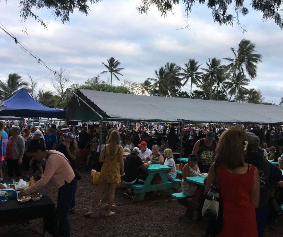 Looking across the Muri Night Markets with al the people sitting on picnic tables and under tents