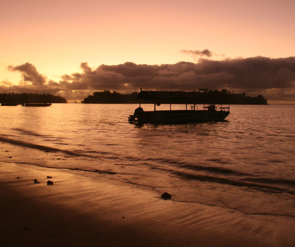 Sunset over looking Muri Lagoon toward Kokomuri island, sky rich with orange