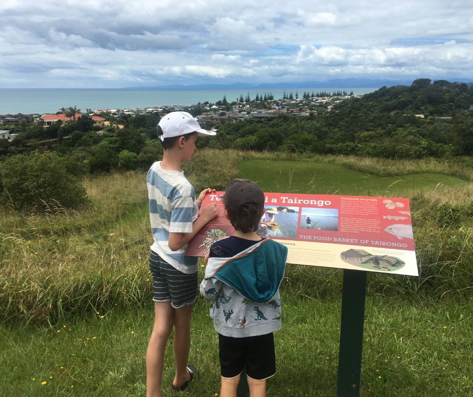 The boys at the top of Tauwhare learning about its rich history. One of the best feee things to do in Ohope if short on time