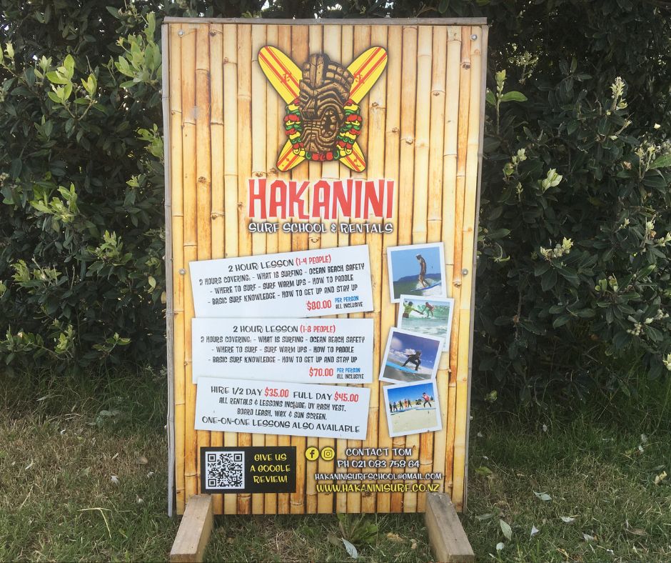 Hakanini Surf School sign will all their lesson prices