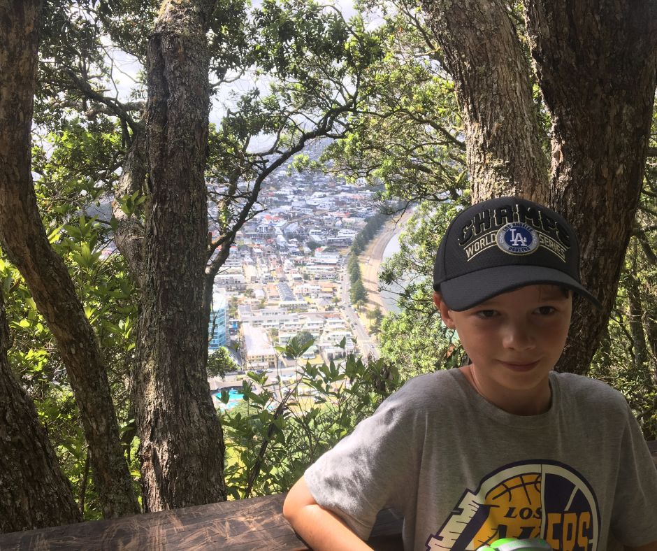 Lukas stopping for a break during our walk up Mauao