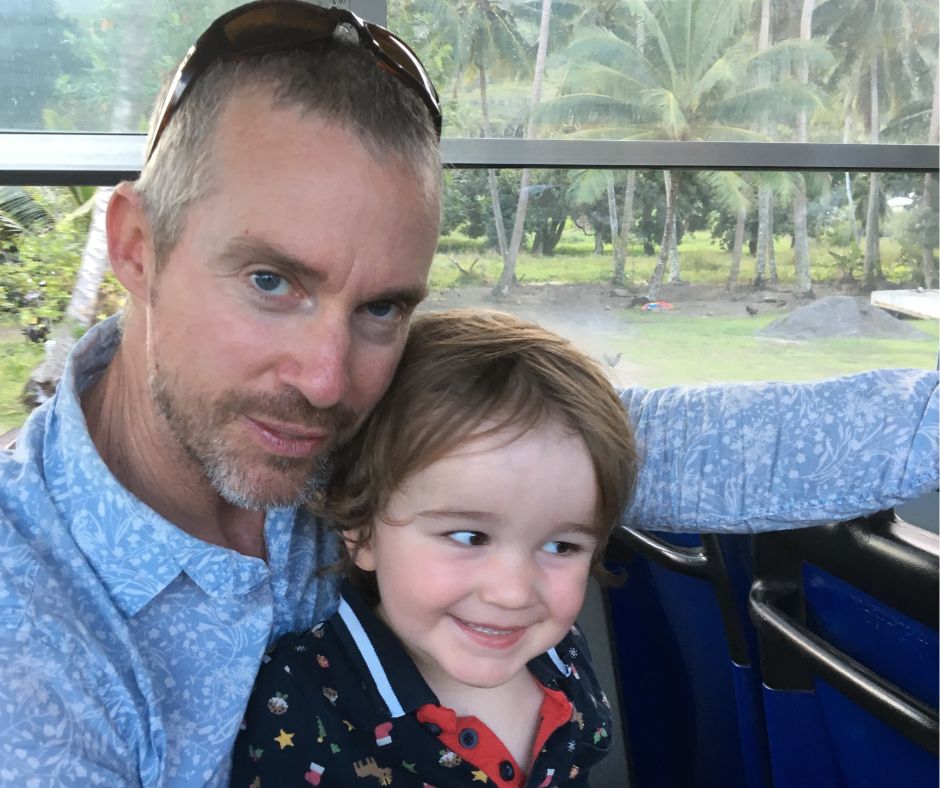 Dad and Sawyer riding the bus to dinners at Frader Jackds