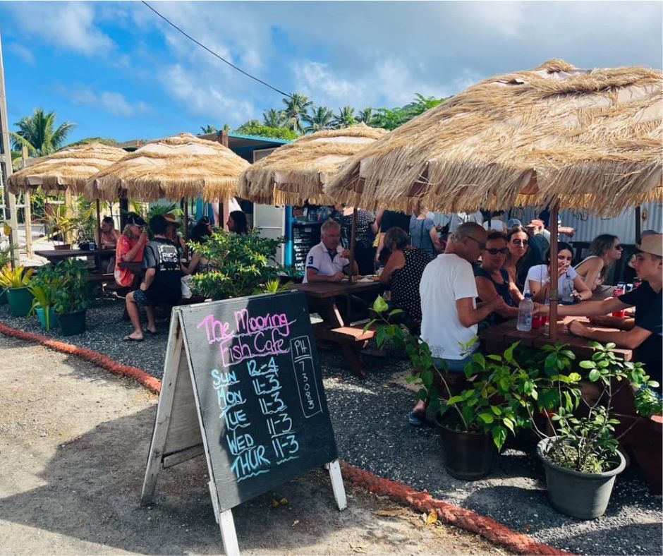 Street view of a packed The Mooring Fish Cafe. Rarotonga's best restaurant and cafe street side appeal