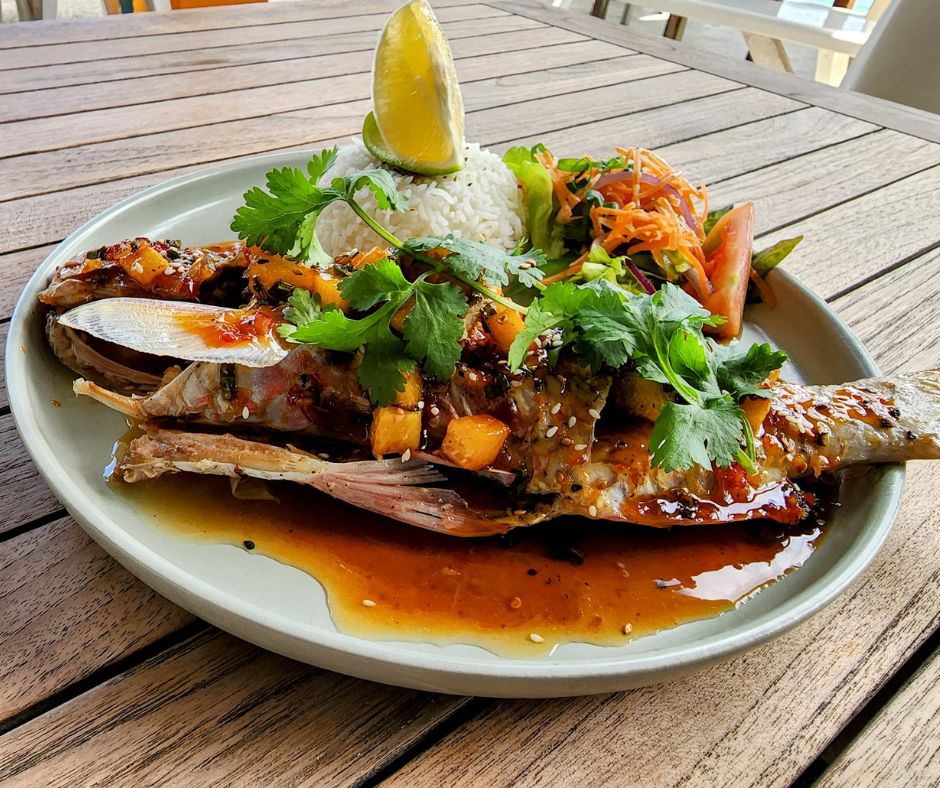 Beautiful plate of fresh fish, rice and salad