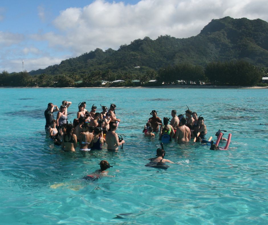 Listening intently to the information being shared about the marine reserve by the Koka Lagoon Cruise crew