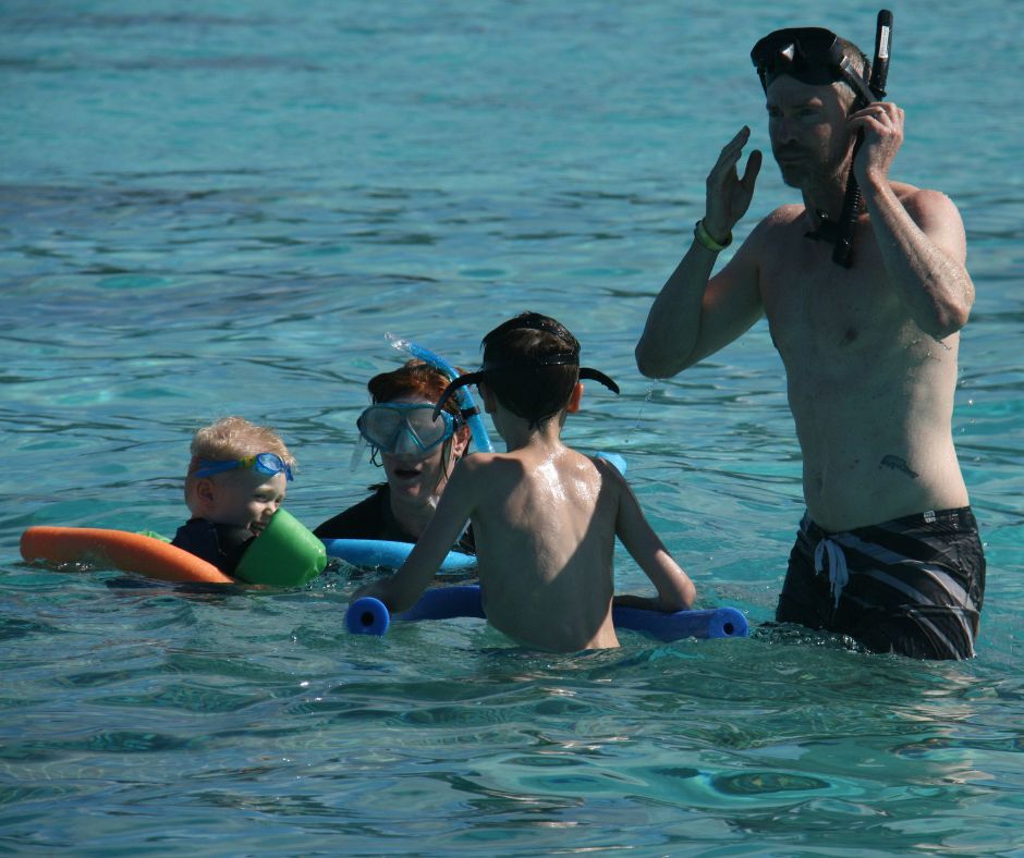 Dad and Lukas standing on a platform as we explore the marine reserve