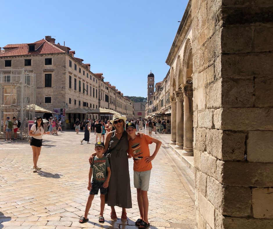 Connie and the boys posing for a photo on one of Dubrovnik's Old Town Streets