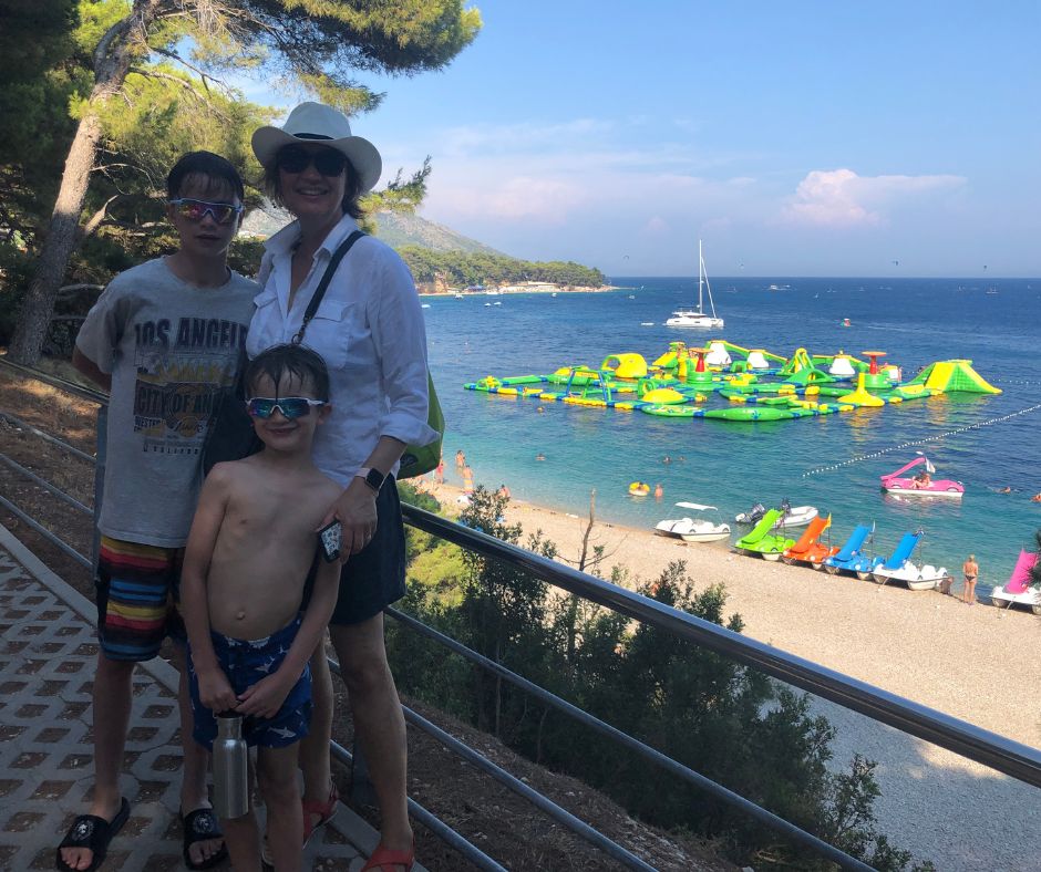 Connie and the boys with the Aqua Park in the background