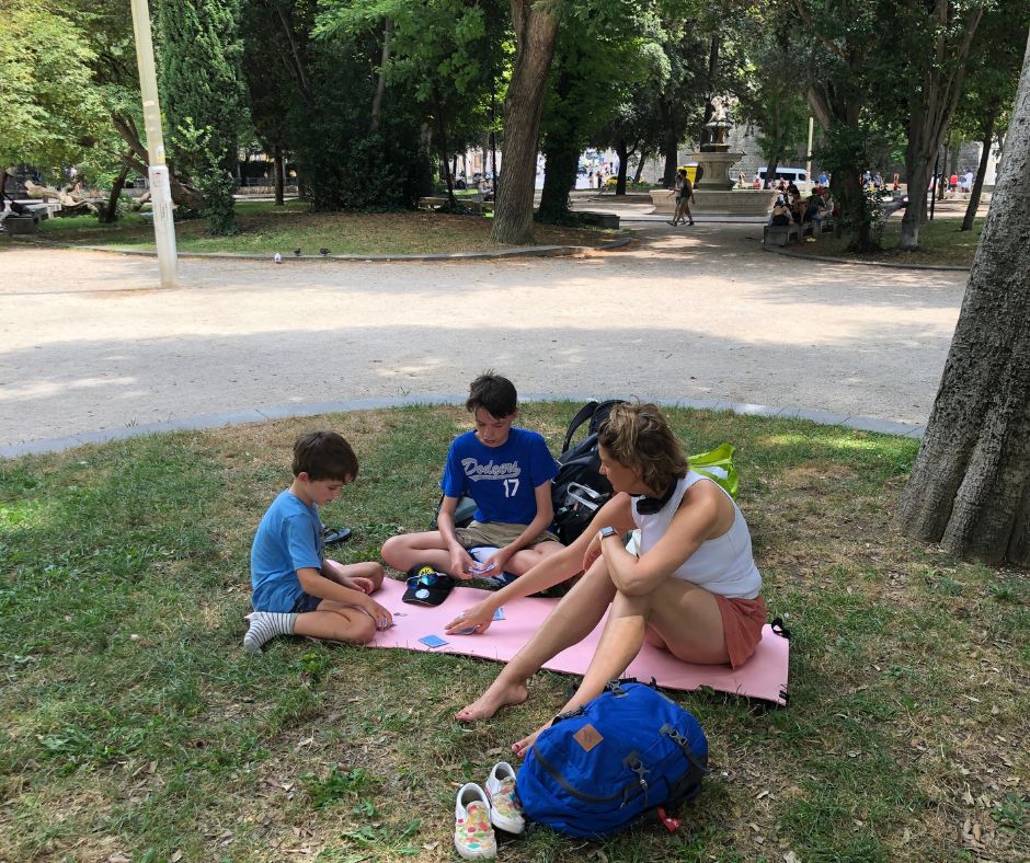 Playing cards in Park Josipa Jurja Strossmayera surrounded by trees