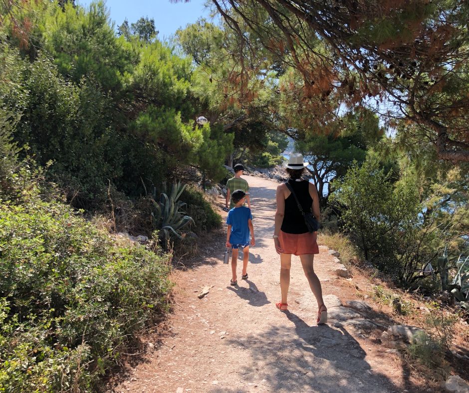 Strolling through St Peters Forest Park. The family walking along with greenery either side