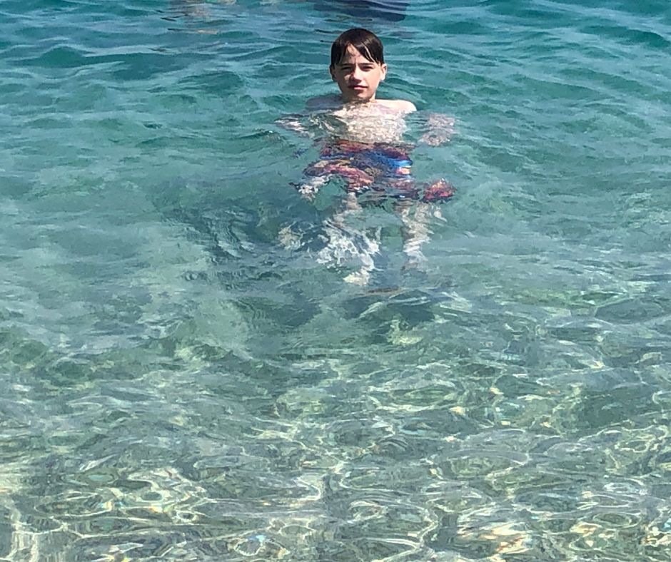 Lukas cooling of in the stuning waters of Zlatni Rat beach