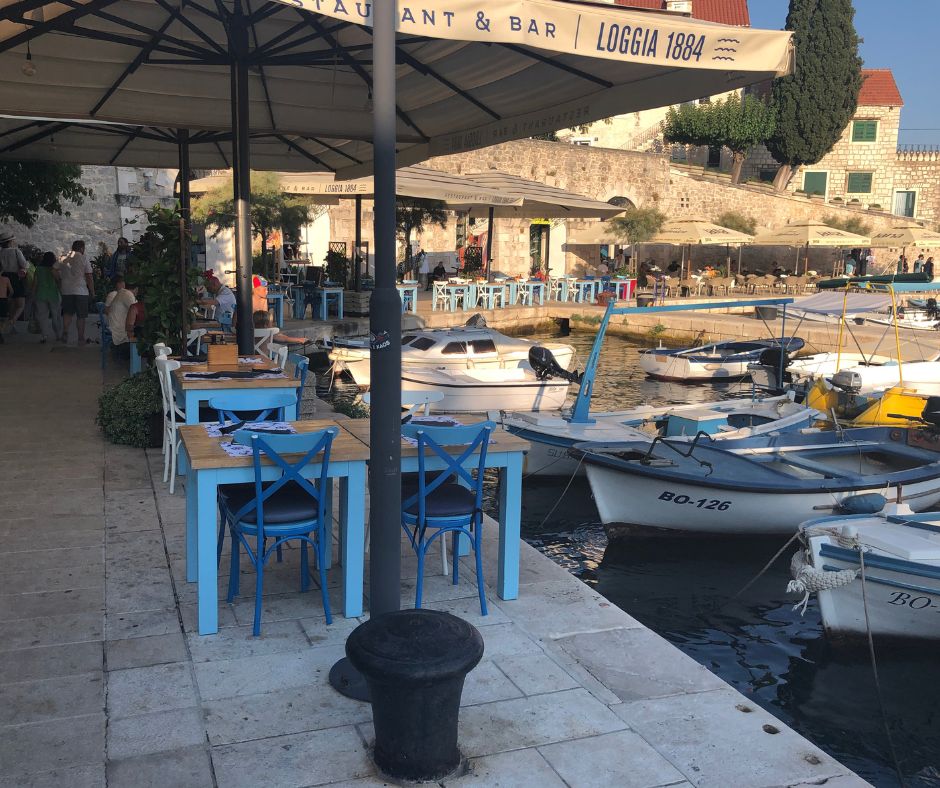 Cafe and boats around Bol Marina