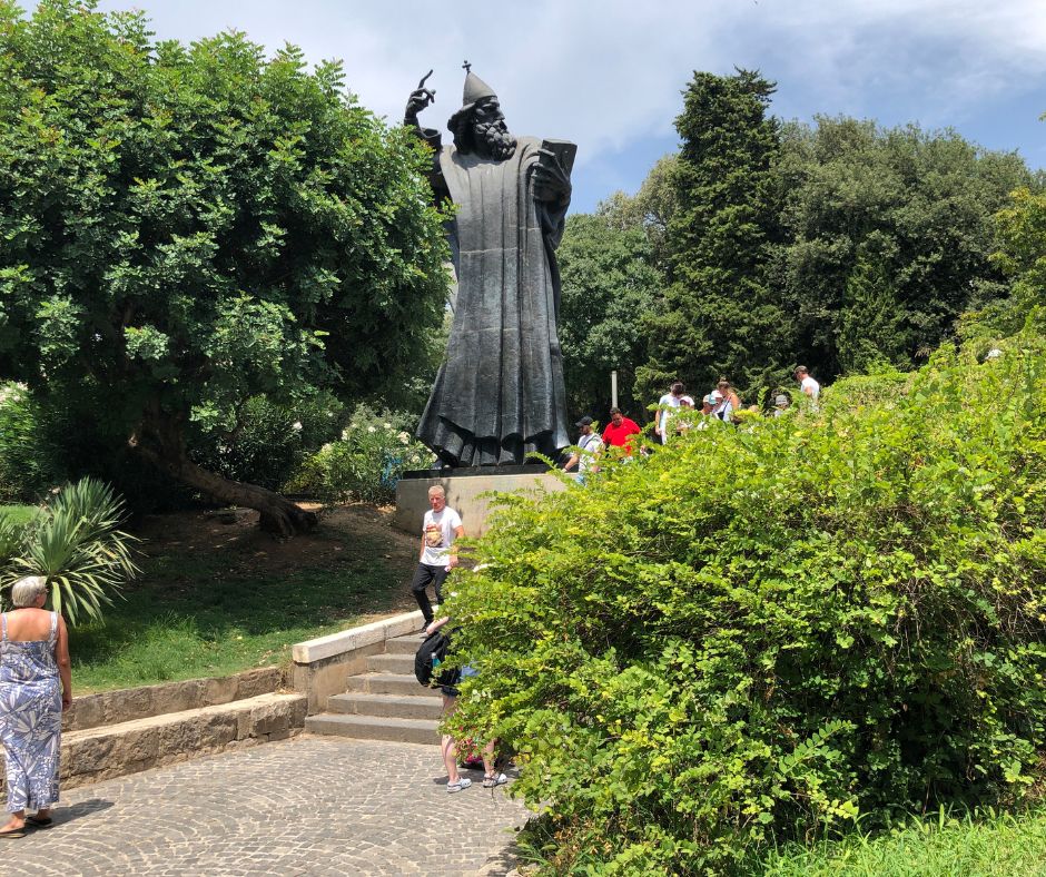 The Monument to Gregory of Nin standing above the surrounds trees