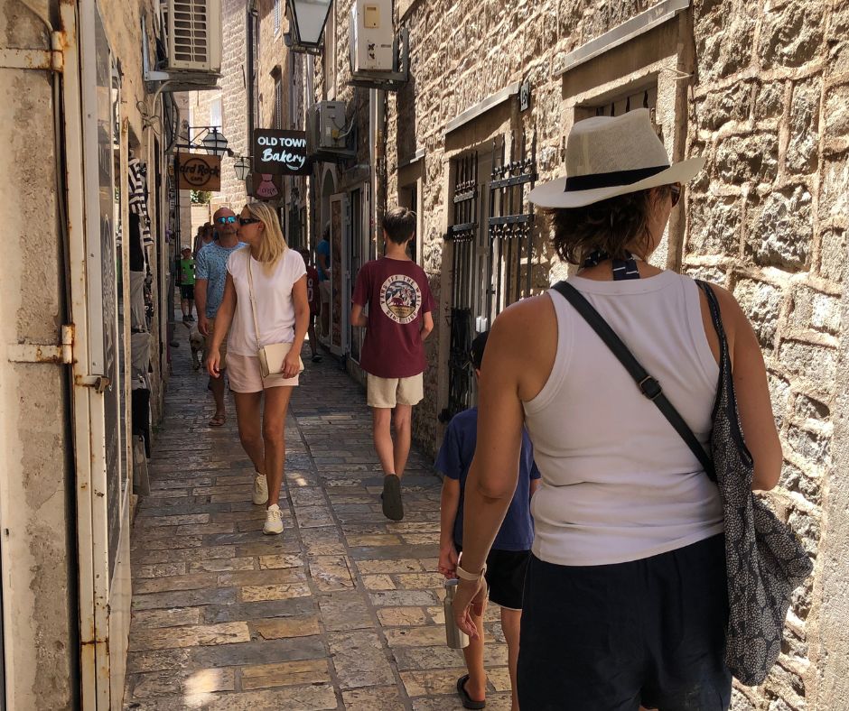 Connir abd the boys walking through the narrow Old Town streets