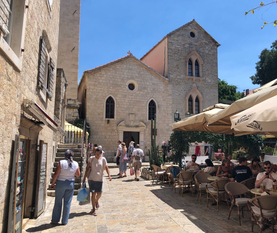 The Old Town of Budva with lovely old buildinga and cafes of the street