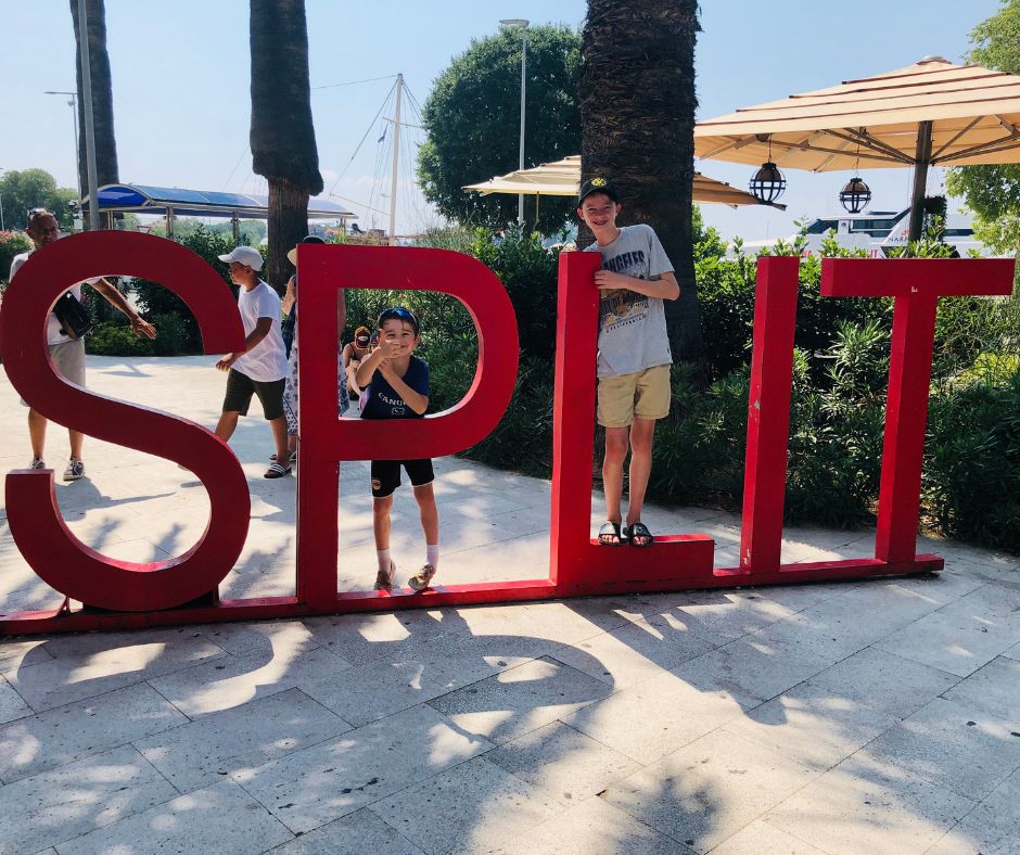 Boys posing on the Split sign