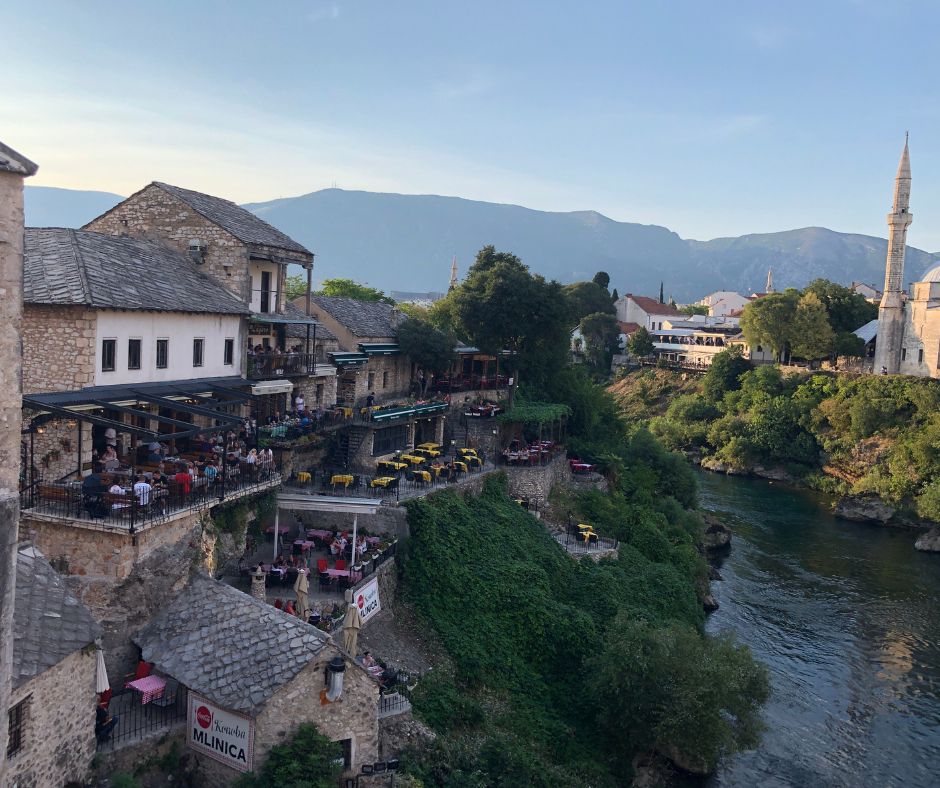 The view from Stari Most looking down river with cafes lining the side