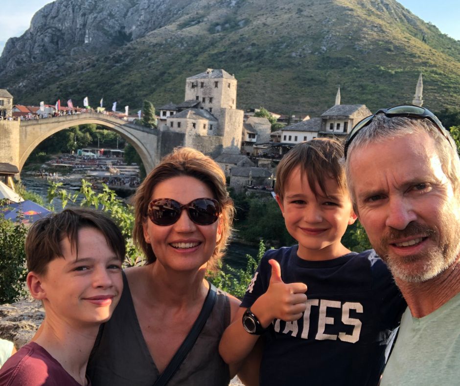 Family photo with Stari Most and Hum Hill in the background