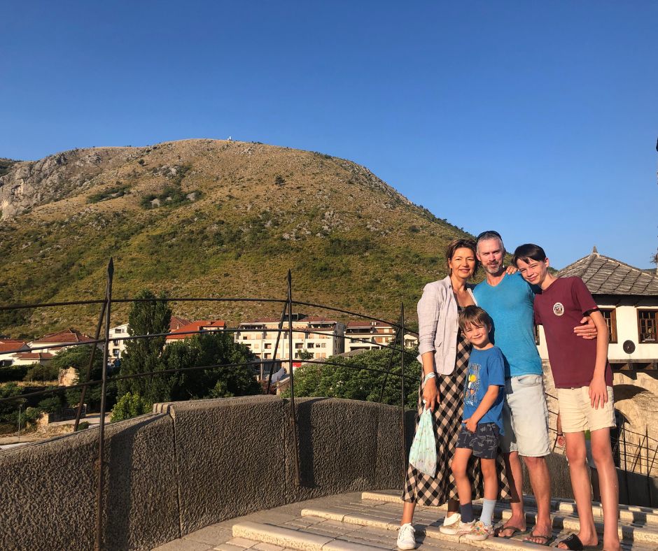 Family photo on Stari Most (bridge) over looking Hum Hill