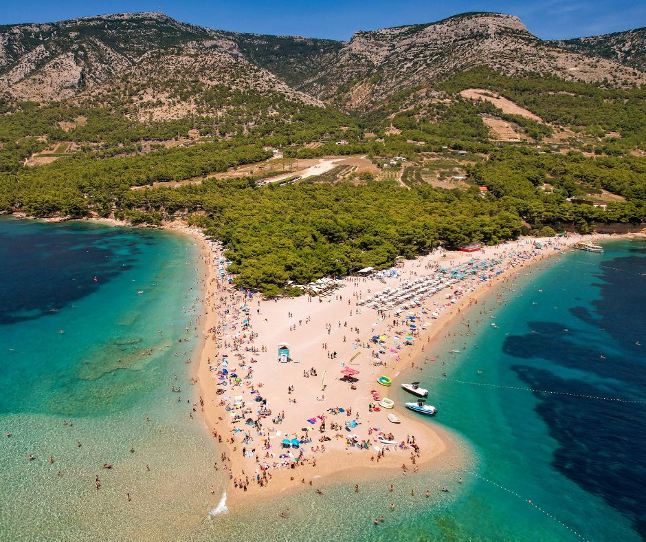 Zlatni Rat beach full view from above with the mountains in the background