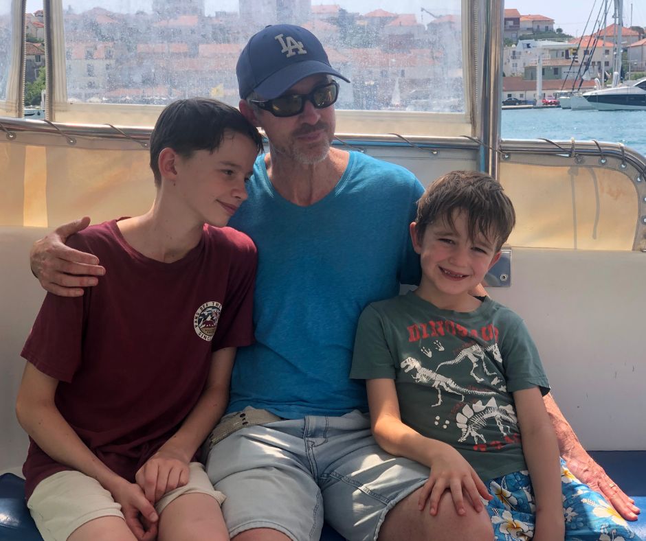 Boys posing for a photo on the ferry as we head from Trogir to Okrug Gronji