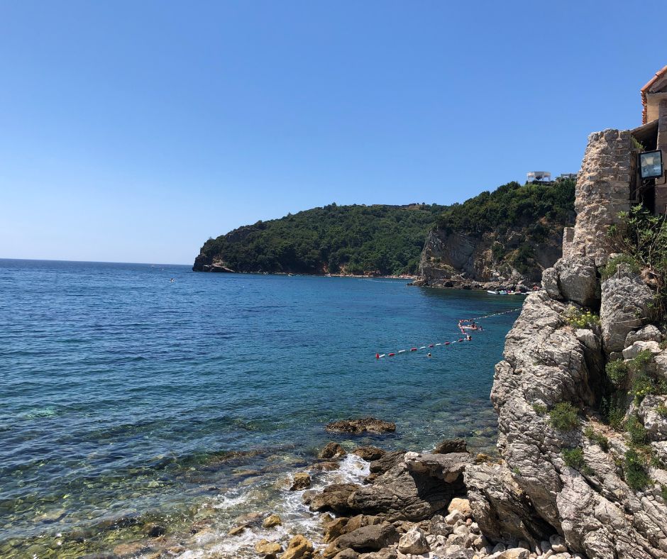 Looking down Budva's coast, there are walkways along cliffs to reach the various beaches