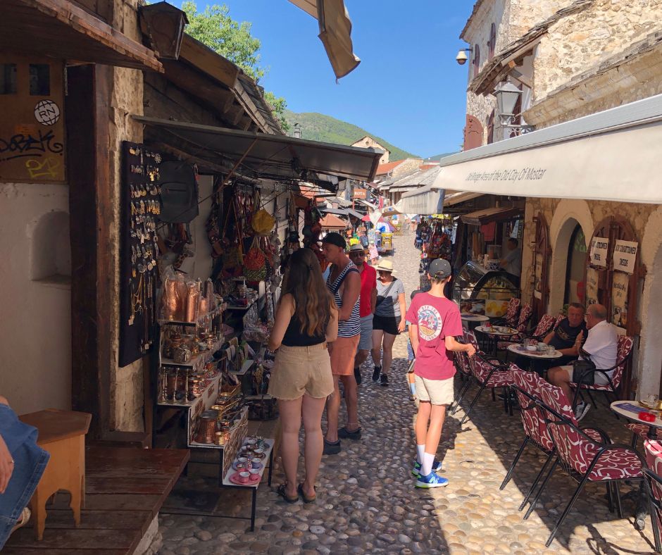 Lukas walking through the Old Town markets and cafes in the Mostar