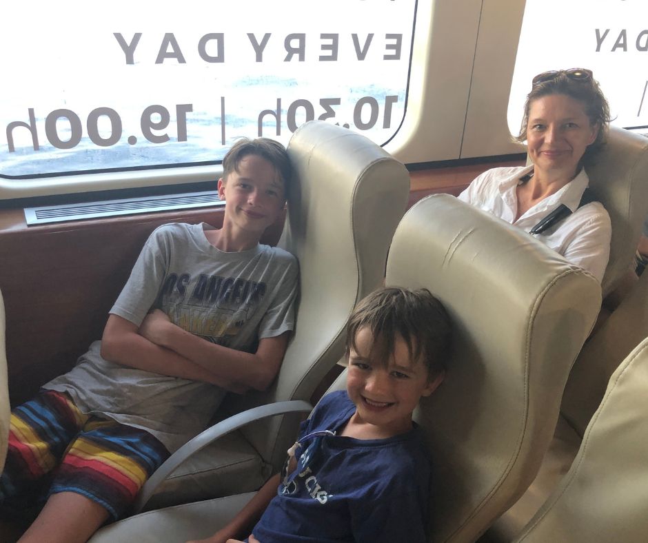 Connie and the boys in their seats on the ferry as we leave Bol