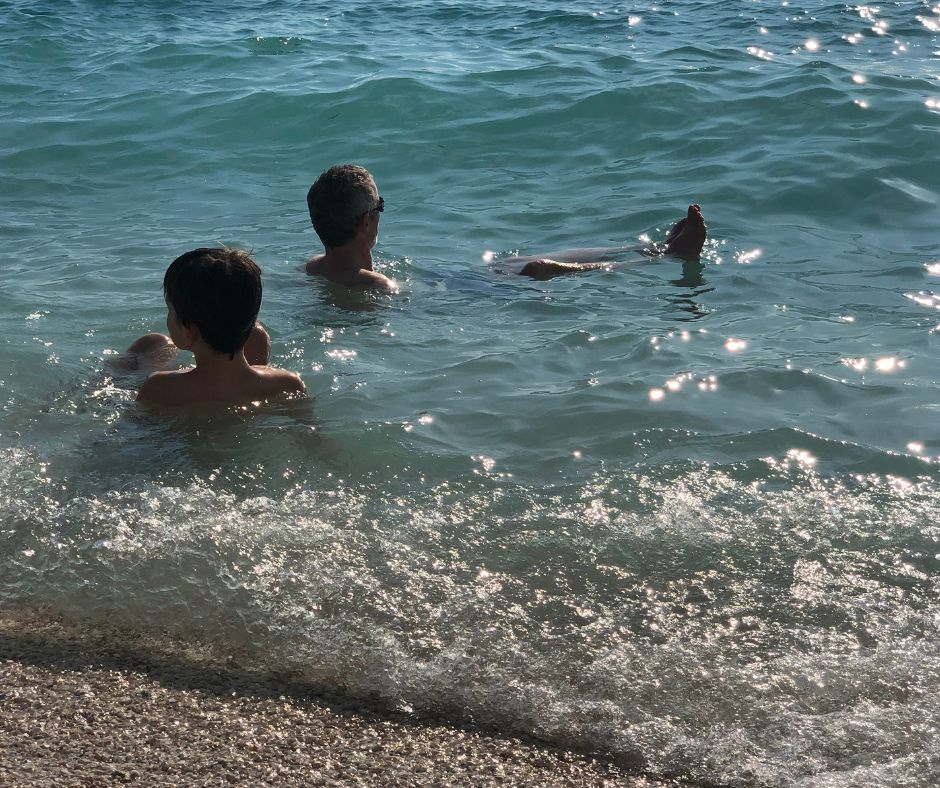 The boys relaxing in the water in Okrug Gronji