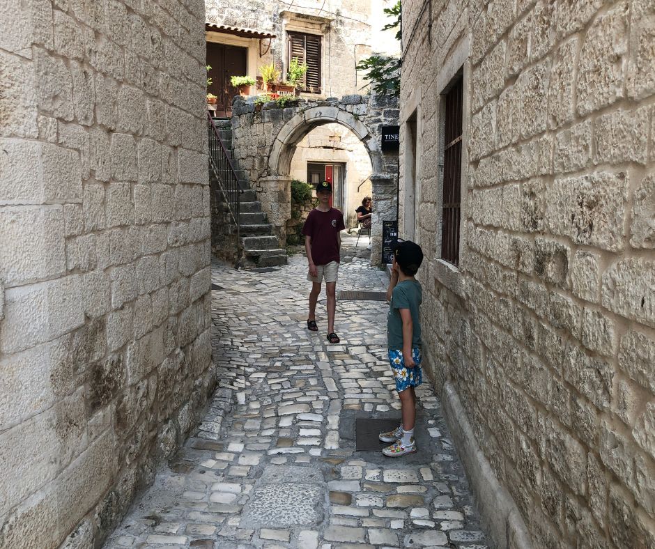 the boys wandering the narrow streets