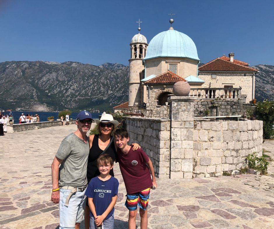 Family photo on Church of Our Lady of Škrpjela in the Bay of Kotor