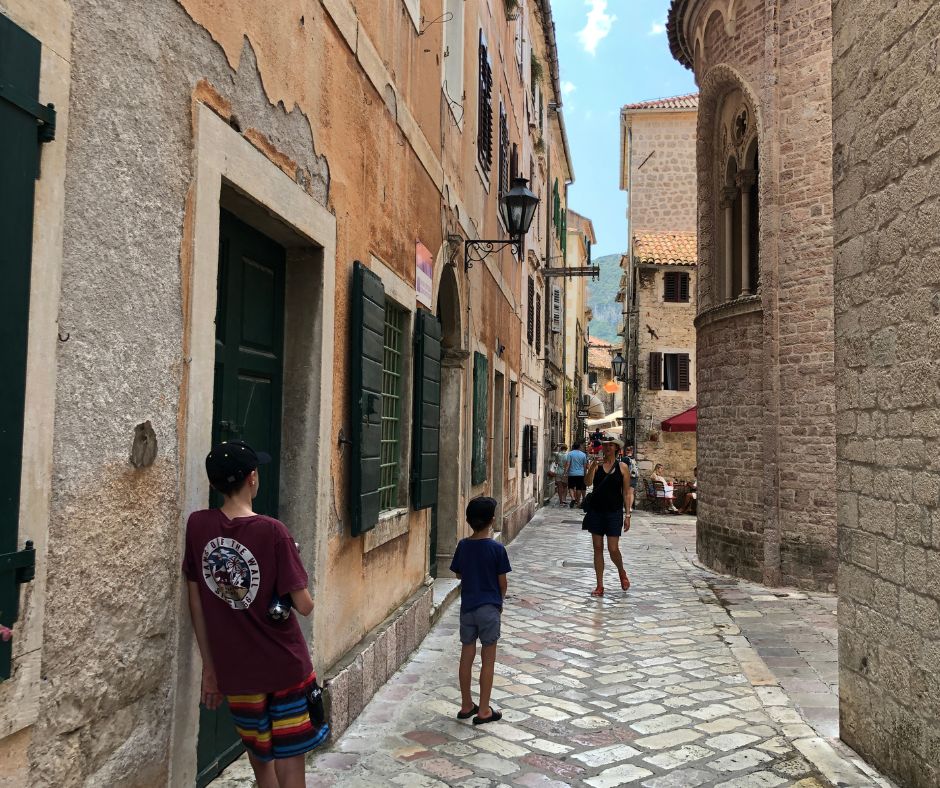 The family wandering through the street of Kotor's Old Town