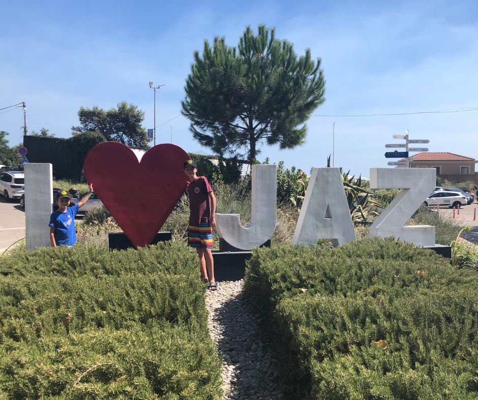 The boys posing for a photo at the famous 'I Love Jaz' sign