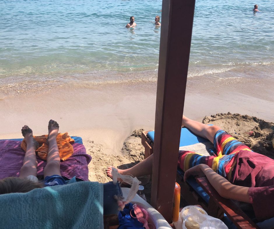 Boys relaxing on their sunloungers