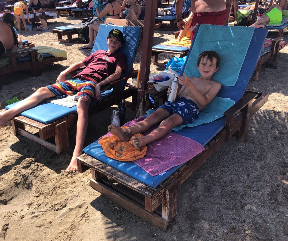 Boys relaxing on the sunloungers at Jaz Beach