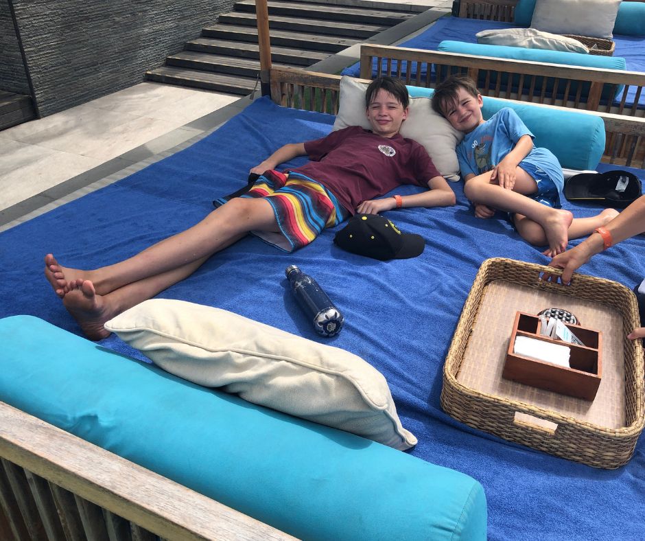 Boys chilling at the start of the day on the day bed