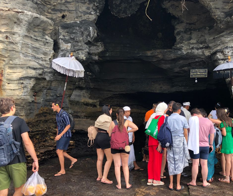 People lining up to be blessed by the priests at Tanah Lot Temple