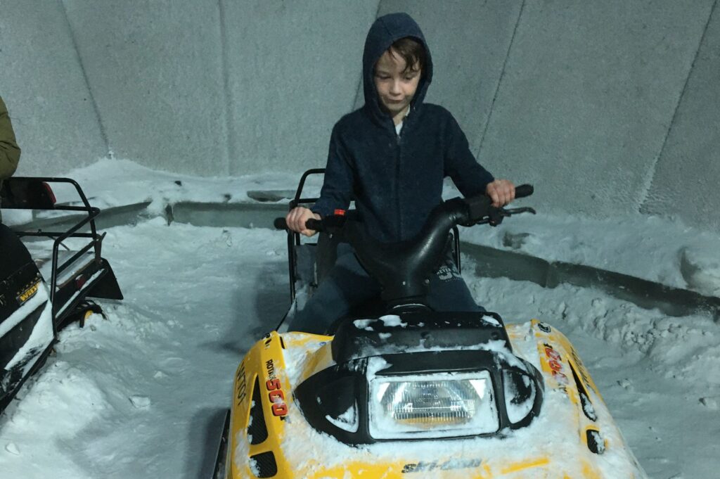 Lukas on a ski mobile
