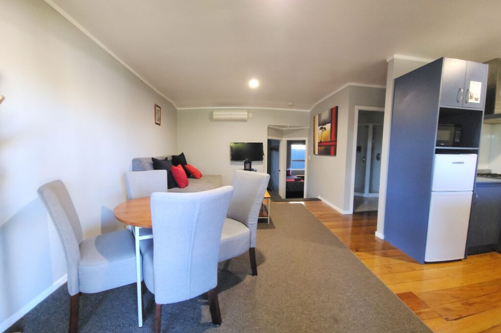 Inside Plateau Lodge's family room, with kitchen lounge and bedrooms